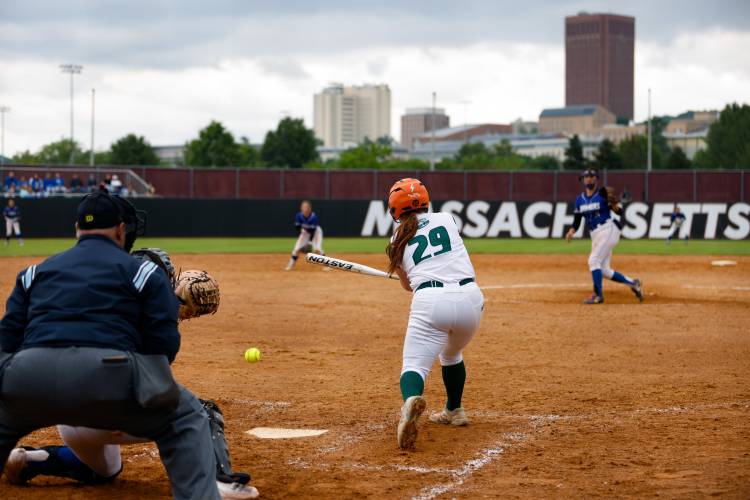 Greenfield’s Olivia Lemay (29) grounds a single against Turners Falls during the MIAA Division 5 softball state championship Saturday at UMass.