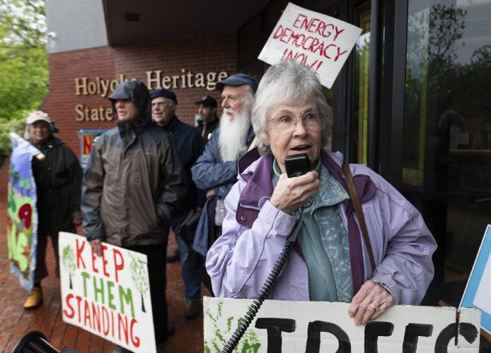 Laurel Facey, of Wendell, speaks during a protest in front of the Holyoke Heritage State Park Visitors Center before state officials gathered inside the building for a stakeholder meeting at which they took comment about clean energy siting regulations contained in the state’s new Climate Action Plan adopted last November. 