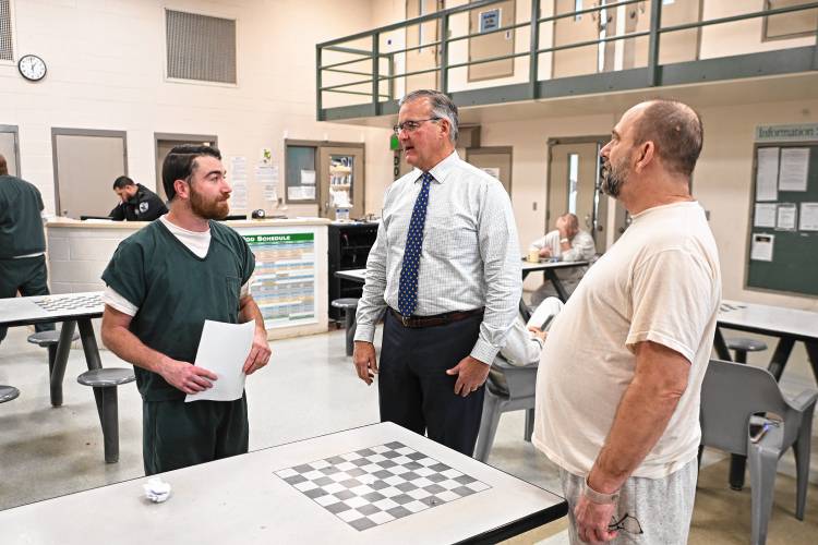 Franklin County Sheriff Christopher J. Donelan, center, talks with inmates Gary Palazzo, left, and Michael Clarke in D Pod at the Franklin County Jail and House of Correction in Greenfield.