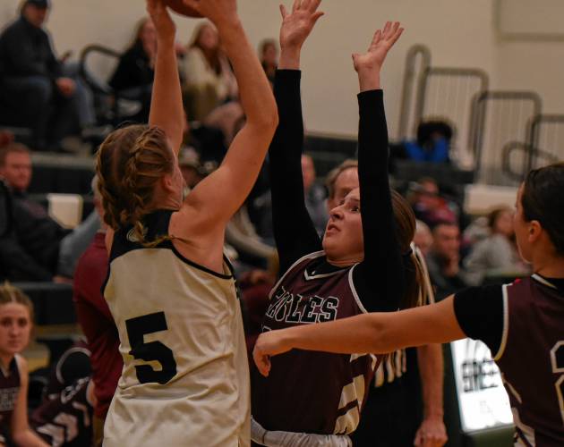 Greenfield’s Gloria McDonald (5) looks to make a pass in traffic against Easthampton during Franklin County League North action Friday night at Nichols Gymnasium in Greenfield.