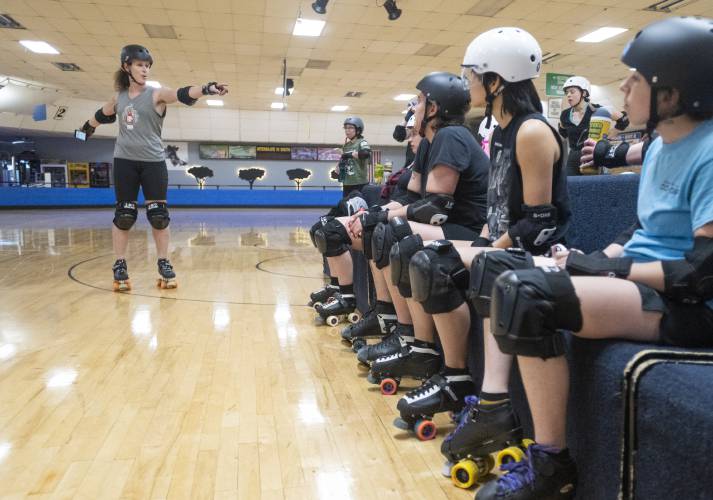 Jamie “Bella LeBrawl” Webb gives instructions during a Western Massachusetts Roller Derby practice at Interskate 91 South, April 3, in Wilbraham.