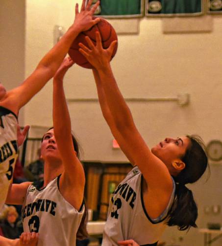 Greenfield’s Niya Strohman (32) looks to pull down a rebound against Easthampton during Franklin County League North action Friday night at Nichols Gymnasium in Greenfield.