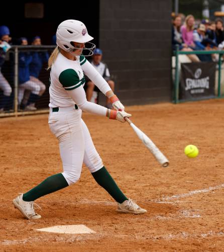 Greenfield’s MacKenzie Paulin (5) hits a single against Turners Falls during the MIAA Division 5 softball state championship Saturday at UMass.