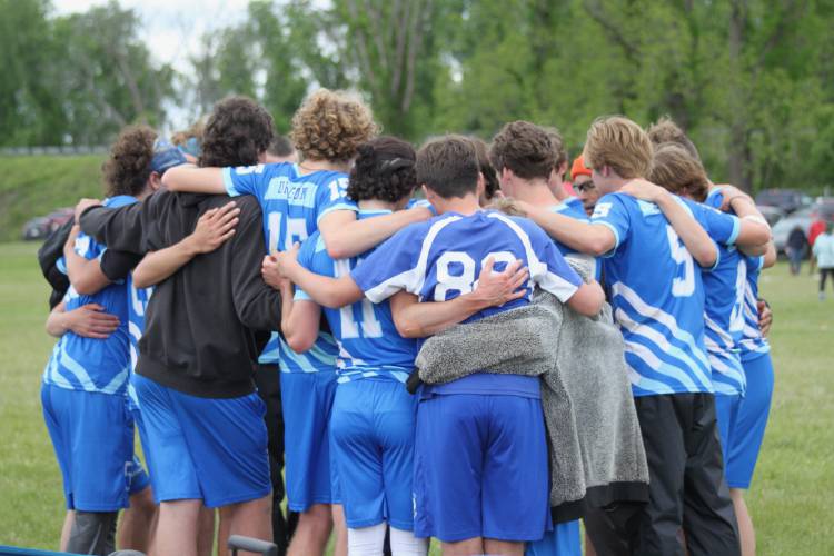 The Four Rivers boys varsity ultimate team huddles up during action at the Division 1 state championship last weekend in Northampton.