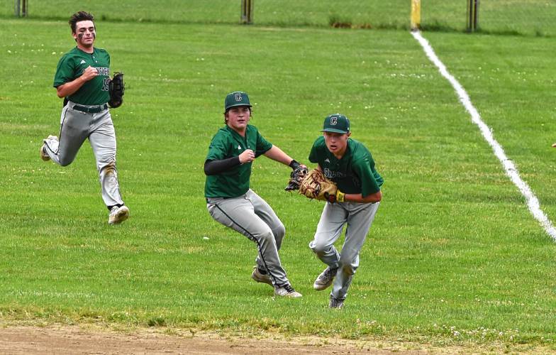 Greenfield first baseman Nick Prasol, right, hauls in an over-the-shoulder catch in shallow right field during his team’s 7-3 win over Bourne in the MIAA Division 5 quarterfinal round on Saturday at Vets Field in Greenfield.