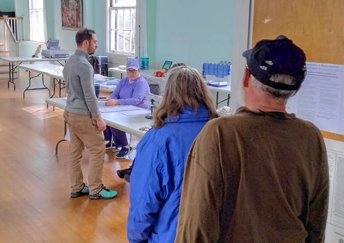 Voters checking in with poll workers in Petersham on Tuesday, Nov. 5.