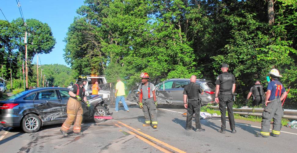 Police and fire work the scene of a three-car accident on Tuesday, July 2.