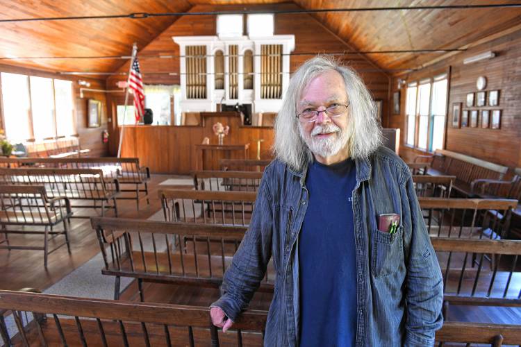 David James in The National Spirit Alliance temple in the Lake Pleasant Village in Montague. Spiritualist temple will close after Nov. 1, due to a declining membership and financial hardships. 