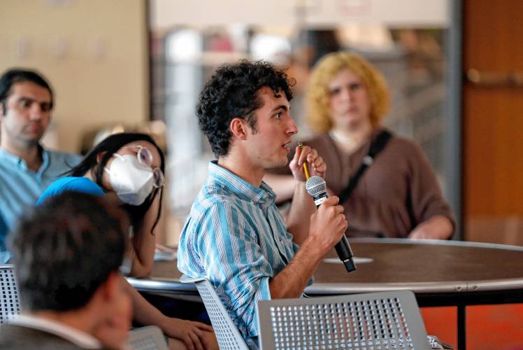 Liam Rue directs a question to the panel during a forum hosted by the Public Higher Education Network of Massachusetts and the UMass Amherst Student Government Association to discuss the Debt Free Future Act with legislators Tuesday at the UMass Amherst Student Union.