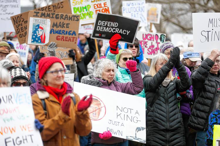 Hundreds of community members demonstrate in Pulaski Park in Northampton during a rally Sunday afternoon organized by the group Northampton Resists.