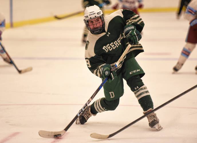 Deerfield Academy’s Kate Doucette (9) fires a shot on the NMH net during the Big Green’s NEPSAC victory on Wednesday at the Class of 1993 Hockey Rink in Deerfield.