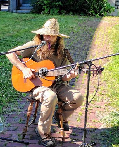 Singer/storyteller Eli Elkus provides musician entertainment at the June 28 Fourth Friday event in Athol.