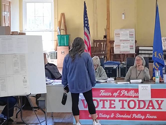 A voter checks in to cast a ballot in Phillipston on Tuesday, Nov. 5. Area town clerks have said that roughly a third of registered voters used early voting options.