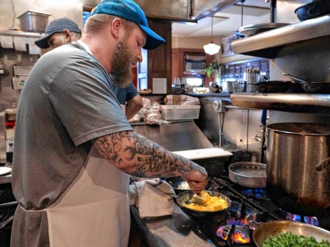 Marc Spivey, a line cook at Jake’s in Northampton, cooks eggs on a busy Monday morning. The restaurant uses 3,000 eggs a week on average, and has had to adjust to skyrocketing prices brought on by an egg shortage caused by the bird flu.