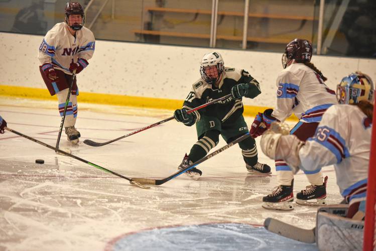Deerfield Academy’s Keira Austen (7) makes a cross-ice pass against NMH during the Big Green’s NEPSAC victory on Wednesday at the Class of 1993 Hockey Rink in Deerfield.