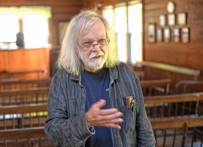 David James in The National Spirit Alliance temple in the village of Lake Pleasant. Citing a declining membership and financial woes, the temple will close this fall, with a possible reopening in the spring.