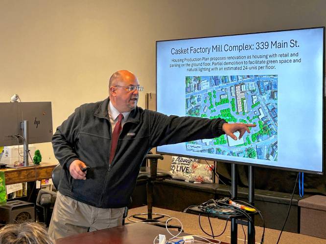 Town Manager Shaun Suhoski discusses redevelopment plans for downtown Athol with state officials and legislators.