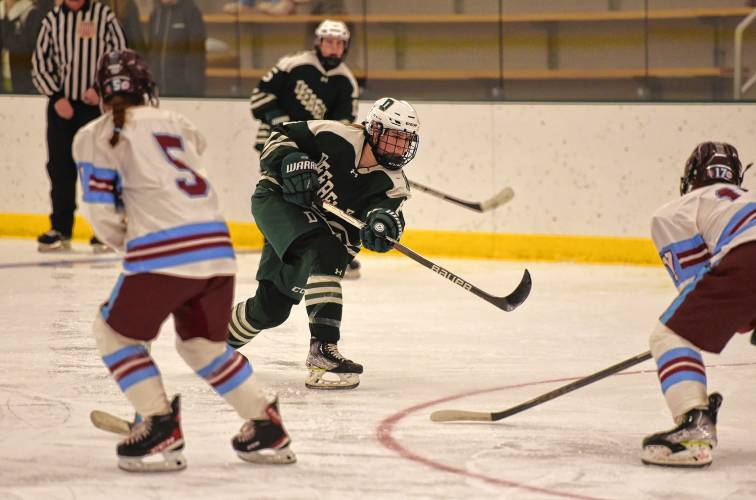 Deerfield Academy’s Gillian Herr (8) rips a shot on the NMH net during the Big Green’s NEPSAC victory on Wednesday at the Class of 1993 Hockey Rink in Deerfield.
