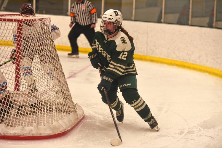 Deerfield Academy’s Brady Wierl (12) skates behind the NMH net during the Big Green’s NEPSAC victory on Wednesday at the Class of 1993 Hockey Rink in Deerfield.