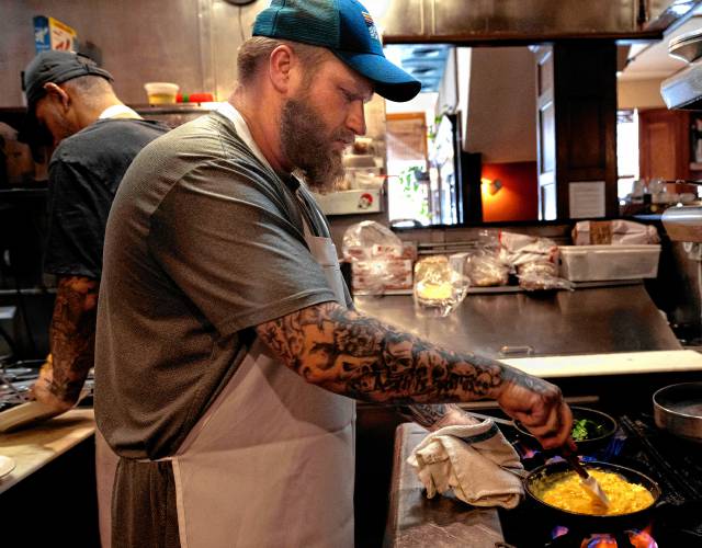 Marc Spivey, a line cook at Jake’s in Northampton, cooks eggs on a busy Monday morning. The restaurant uses 3,000 eggs a week on average.