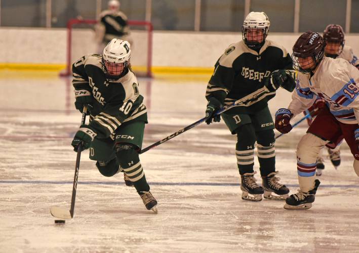 Deerfield Academy’s Ava Carvel (10) skates toward the NMH net during the Big Green’s NEPSAC victory on Wednesday at the Class of 1993 Hockey Rink in Deerfield.