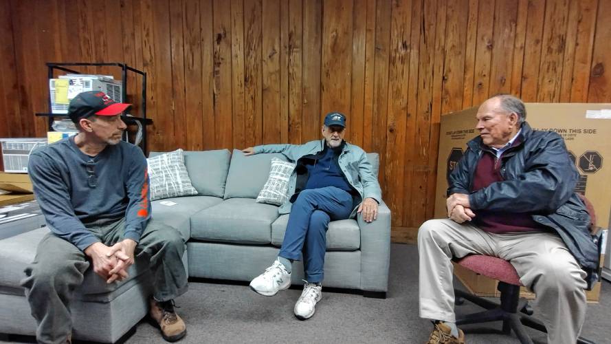 Current S&S Appliance owner Mark Armentrout (l-r) speaking with previous owner Mark Duguay and company founder Charlie Shatos. The Main Street store is celebrating its 50th anniversary.