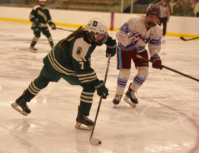 Deerfield Academy’s Olivia Austen (7) fires a shot on the NMH net during the Big Green’s NEPSAC victory on Wednesday at the Class of 1993 Hockey Rink in Deerfield.