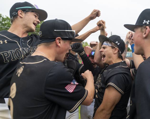 Pioneer players break from a huddle after winning the PVIAC Class D championship game against Hopkins Academy 4-2 at Mackenzie Stadium on May 28 in Holyoke.