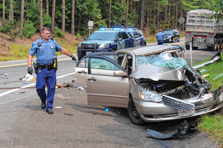 Massachusetts State Police troopers investigate a collision where Route 2 meets Route 2A in Erving that hospitalized three individuals on Friday afternoon. Massachusetts State Police troopers investigate a collision where Route 2 meets Route 2A in Erving that hospitalized three individuals on Friday afternoon.
