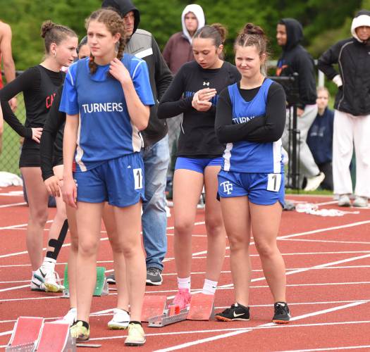 A group of Turners Falls athletes stand and await the start of an event at the Division 2 Western Massachusetts championships at Mount Greylock Regional School on Saturday afternoon.