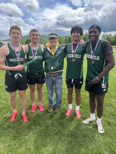 From left to right: The Greenfield 4x100 team of Jack Laurie, Caleb Murray, coach Pete Conway, Krish Patel and Kymel Ramsey after the Wave took first at the Western Mass. Div. 2 Championship Saturday at Mt. Greylock. 