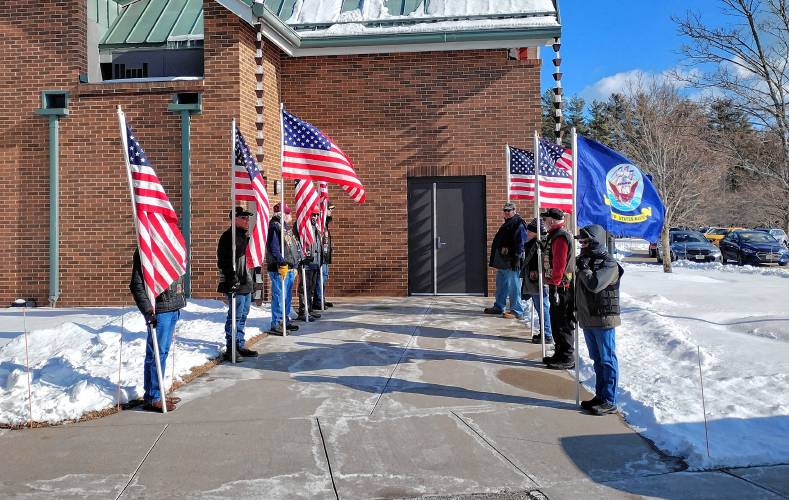 Members of the Patriot Guard Riders line one of the entrances to the funeral for Navy veteran William Carver held Friday at the Massachusetts Veterans Memorial Cemetery in Winchendon.