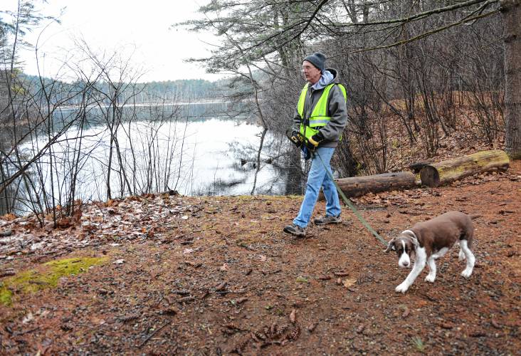 Orange resident Bill Dolan walks Darby at Kiwanis Bicentennial Park in Orange. Orange resident Bill Dolan walks Darby at Kiwanis Bicentennial Park in Orange.