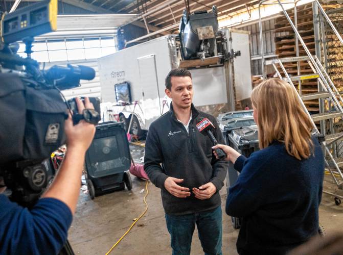 rStream Co-Founder Ian Goodine talks to the press during a showcase event at the UMass Waste Recovery and Transfer Facility, Friday, March 14, in Amherst.