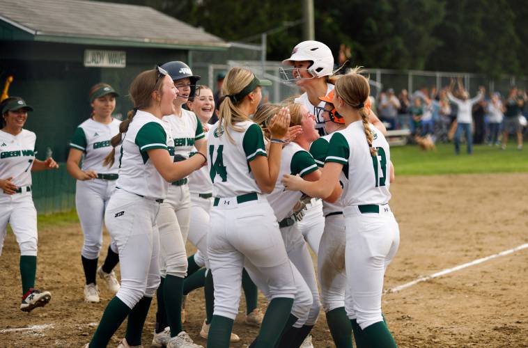 Greenfield players celebrate as Olivia Lemay crosses home plate to score the game-winning run against West Boylston in the bottom of the seventh inning Sunday during the MIAA Div. 5 quarterfinal game in Greenfield.