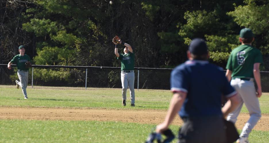 Greenfield’s Arthur Fitzpatrick (14) catches a pop fly in short right-center field during the Green Wave’s 10-0 win over Granby on Monday afternoon in Granby.
