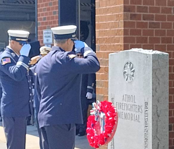 Athol Fire Department Capts. Kevin Kaczmarczyk and Andrew Soltysik lay a wreath at the Athol Firefighters Memorial for a June 2 ceremony.