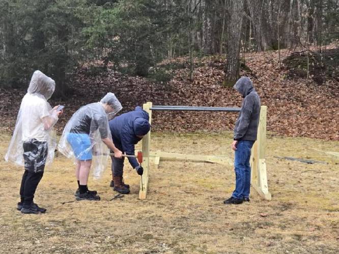 Dylan Wornham and a team of volunteers work on new fitness stations at Silver Lake Park in Athol, done as part of Wornham’s Eagle Scout project. 