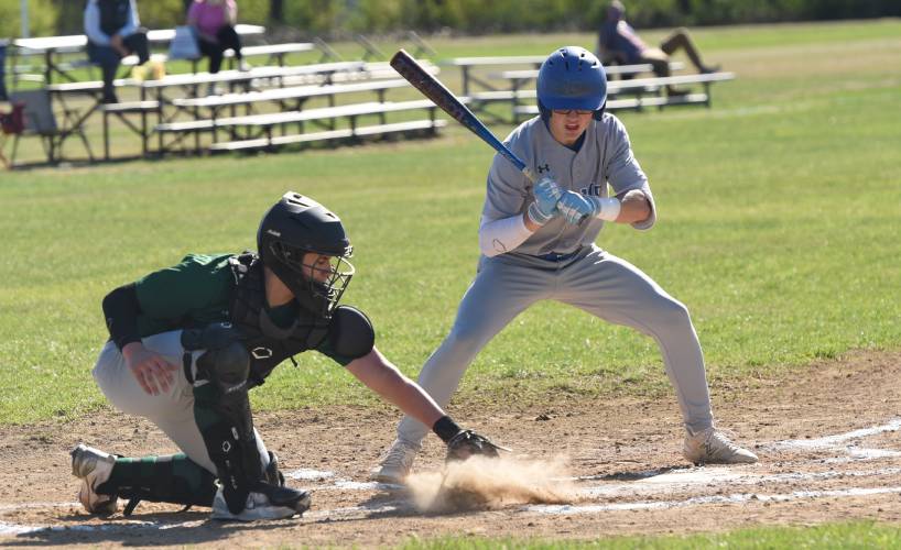 Granby’s Brandon Carillon watches a ball in the dirt during the Rams’ loss to Greenfield on Monday afternoon in Granby.