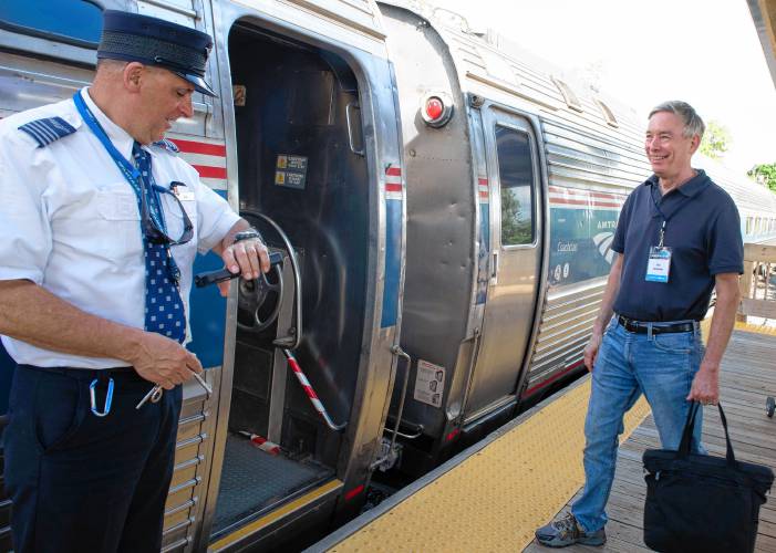Ben Heckscher, co-founder of Trains in the Valley, gets ready to board the Valley Flyer as it makes its stop in Northampton on Tuesday evening. Amtrak has launched a new service that offers a northbound train in the afternoon from New Haven, Connecticut, to Greenfield, with stops in Springfield, Holyoke and Northampton. 