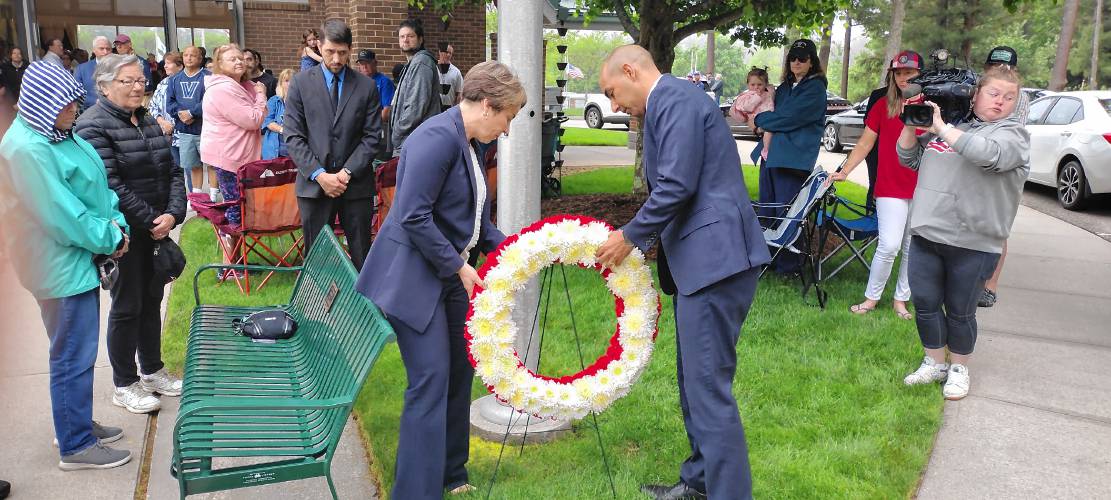 Gov. Maura Healey and Veterans Services Secretary Jon Santiago laying a wreath at the state Veterans Memorial Cemetery in Winchendon on Monday, where the governor gave a keynote speech.