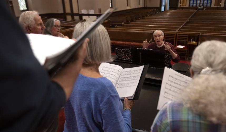 Dick Matteson plays piano with a small part of the choir a the First Congregational Church of Amherst where he has been the minister of music for the past 17 years. Matteson is retiring after 65 years as a church musician. 
