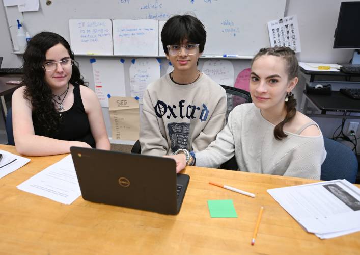 Athol High School students Kaitlyn Rossi, Om Patel and Piper Bailey, the staff of the Athol Advocate newspaper.