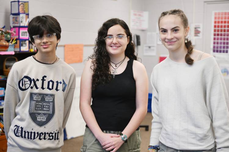 Athol High School students Om Patel, Kaitlyn Rossi and Piper Bailey, the staff of the Athol Advocate newspaper.