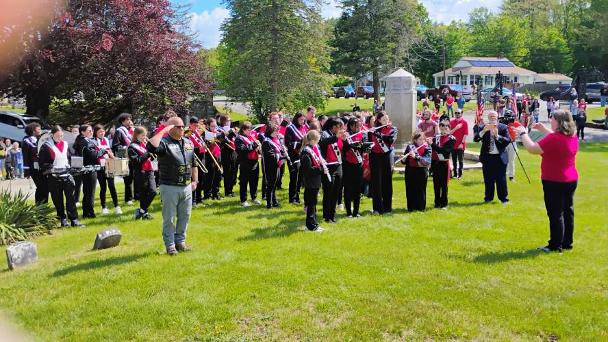 The Athol High School/Middle School Band plays the National Anthem during Memorial Day ceremonies at Silver Lake Cemetery.
