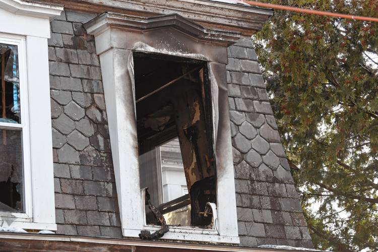 Second floor window in home at 86 Mechanic Street in Orange.