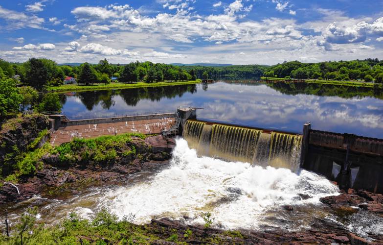 The flowing waters of the Connecticut River reflect the sky before plummeting onto the rocks below the Turners Falls Dam. The flowing waters of the Connecticut River reflect the sky before plummeting onto the rocks below the Turners Falls Dam.