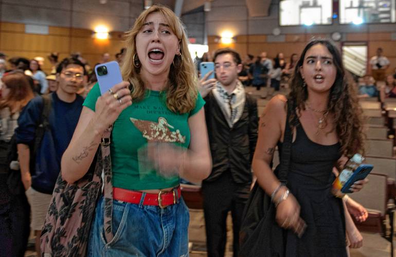 Umass students chant and yell as they leave Mahar Auditorium after they leave a Special Meeting of the Faculty Senate where Chancellor Javier Reyes
and members of his administration made a presentation and answered questions about the campus protest, and policing actions occurring on May 7th through May 8th.