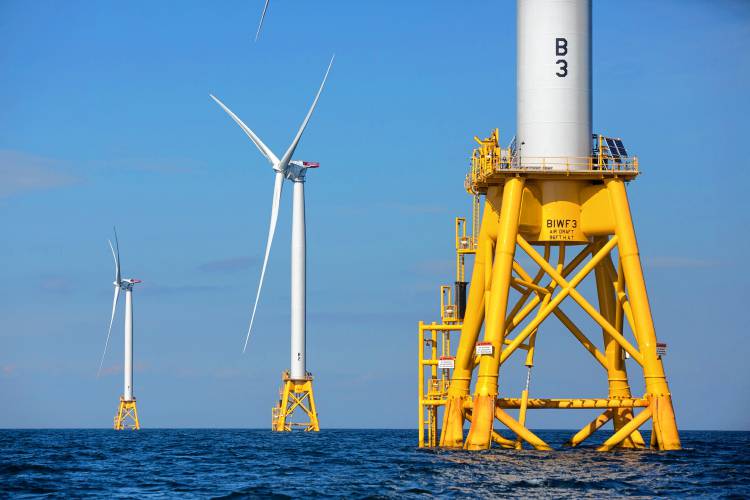 In this Aug. 15, 2016 file photo, three of Deepwater Wind’s five turbines stand in the water off Block Island, R.I, the nation’s first offshore wind farm. In this Aug. 15, 2016 file photo, three of Deepwater Wind’s five turbines stand in the water off Block Island, R.I, the nation’s first offshore wind farm.
