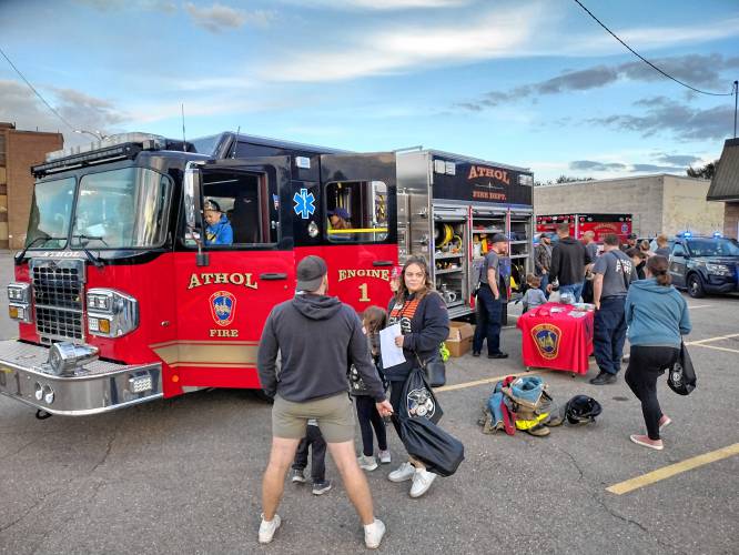 A display of Athol firefighting vehicles equipment attracted the attention of kids and adults alike at the National Night Out event on Oct. 6.